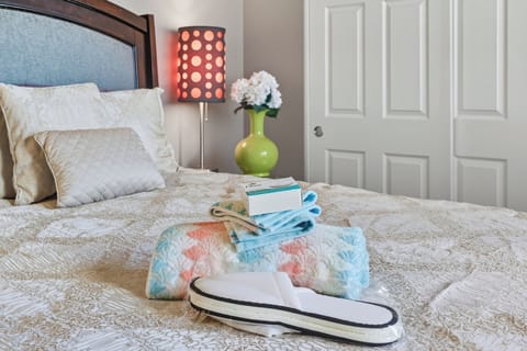PLUSH SLIPPERS,  LINENS AND TOWELS