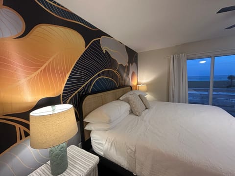Wake up to the gentle sound of waves and the soft glow of morning light streaming through expansive windows.