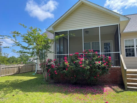 Screened in patio with side deck.