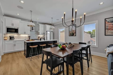 2nd Floor: Formal dining area featuring a large table set to accommodate 8 guests.
