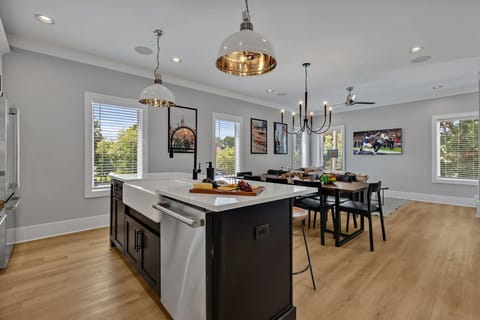 2nd Floor: Fully equipped kitchen, complete with all essential culinary tools, boasts stainless-steel appliances and a spacious island with ample counter space and bar seating.