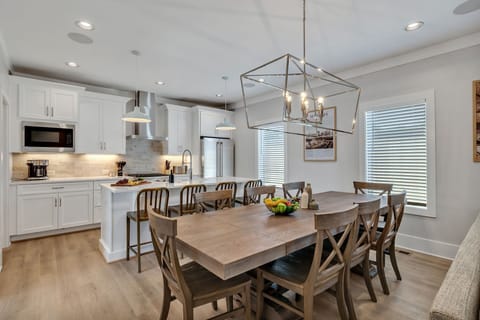 2nd Floor: Formal dining area featuring a large table set to accommodate 8 guests.