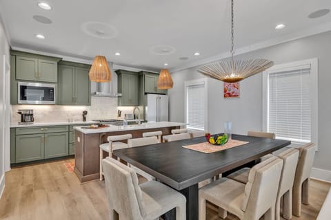 2nd Floor: Formal dining area featuring a large table set to accommodate 8 guests.