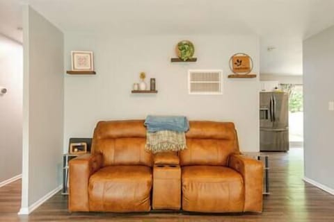 Motorized reclining loveseat with charging ports and cupholder