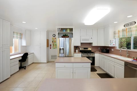 The kitchen has lots of space for the gourmet cook....and yes, that's a desk if you need to get some work done!