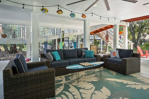 WOW! Check out this great outdoor space, fully shaded with big screen TV, ceiling fan, and bar area! So much fun to be had in and around this lovely property. The owners really went all out.