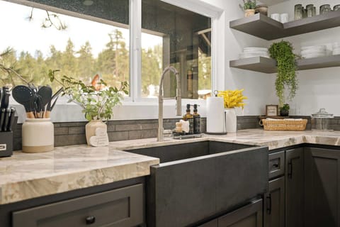 Large farmhouse sink with lake view from kitchen.