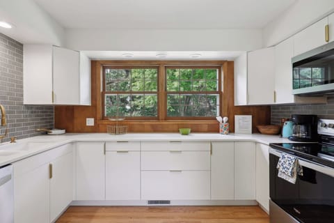 Kitchen overlooks the beautiful backyard.