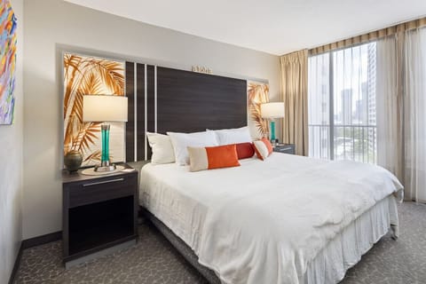 Bright bedroom w/ soft light & balcony vibes for slow, easy mornings.