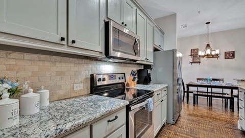 Refrigerator, microwave, and electric stove top.
