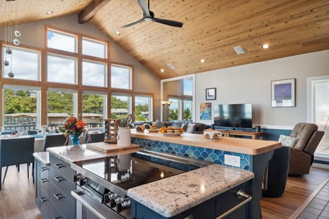 Open living space with newly remodeled kitchen, living room with Smart TV, streaming only, dining room. All with ocean views. Access to deck with outdoor seating and Gas BBQ.