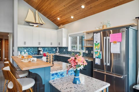 Open living space with newly remodeled kitchen, living room with Smart TV, streaming only, dining room. All with ocean views. Access to deck with outdoor seating and Gas BBQ.