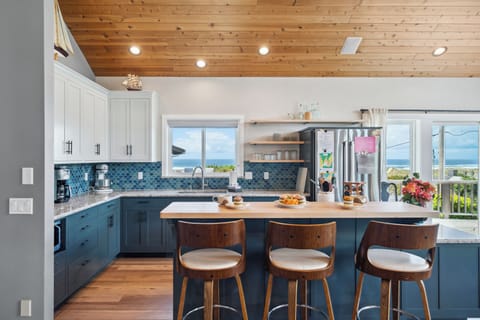 Open living space with newly remodeled kitchen, living room with Smart TV, streaming only, dining room. All with ocean views. Access to deck with outdoor seating and Gas BBQ.