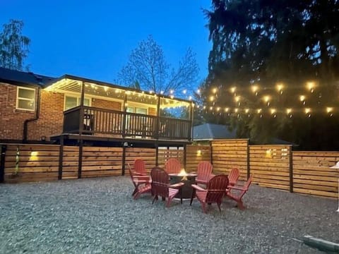 - Outdoor fire pit with Adirondack chairs under twinkling lights  
- Deck and patio create cozy evening gathering spaces  
- Perfect for relaxing nights in a private backyard  