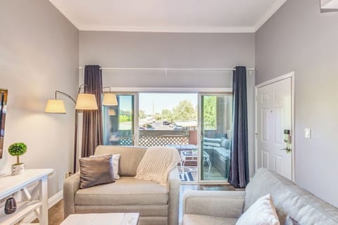 Relax on comfy sofas or enjoy the breeze on the private balcony.