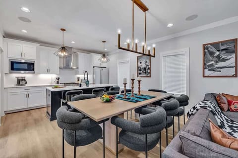 2nd Floor: Formal dining table between the living room and kitchen offering a large table to accommodate 8 guests.