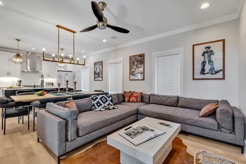 2nd Floor: Stylish open-concept living space seamlessly flowing the designer furnished living room, with the fully equipped kitchen and dining area.