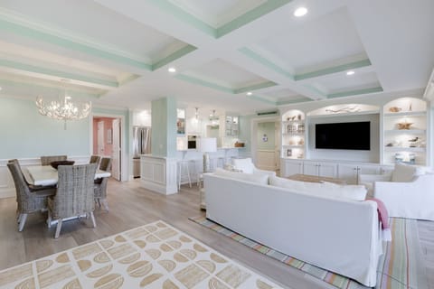 Gorgeous open concept living room with paneled ceilings