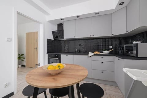 A view into the modern kitchen from the dining area. Thoughtful layout and high-end appliances.