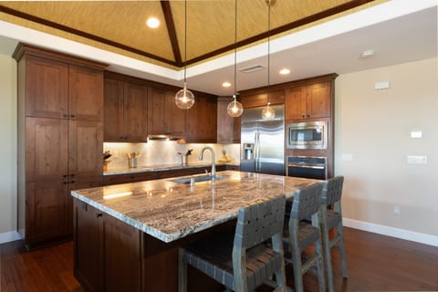 Open concept kitchen with seating for 3 at the island