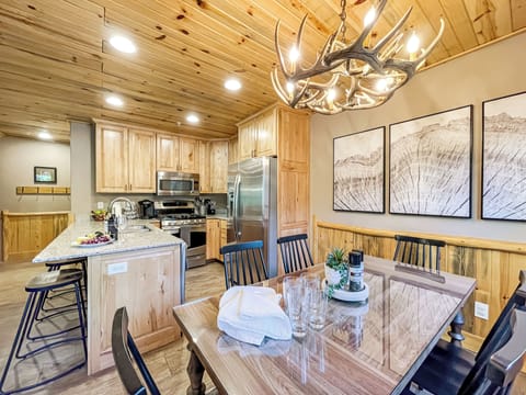 You're sure to enjoy a meal, or maybe some games, at the dining table with seating for 6.