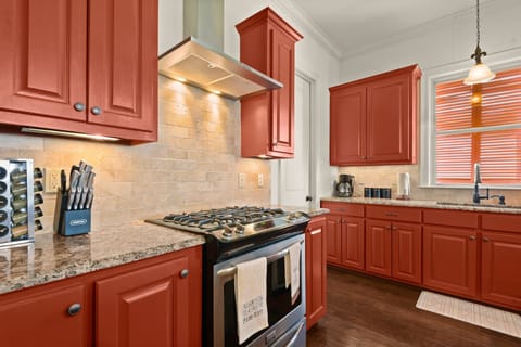 Fully stocked kitchen with island seating.
