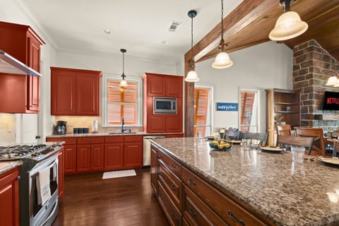 Fully stocked kitchen with island seating.