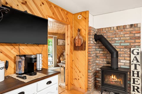 Main cabin coffee station and fireplace in the kitchen