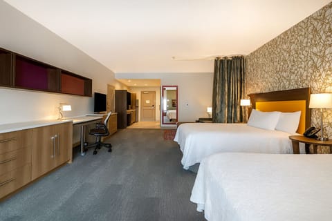 Stretch out with two plush beds and a dedicated work zone.