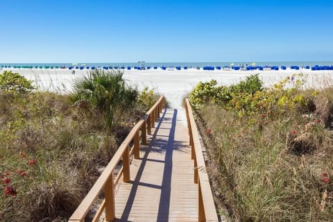Walk straight to the beach along your private boardwalk.