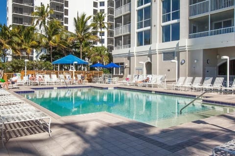 Sip and sunbathe while the pool buzzes with energy.