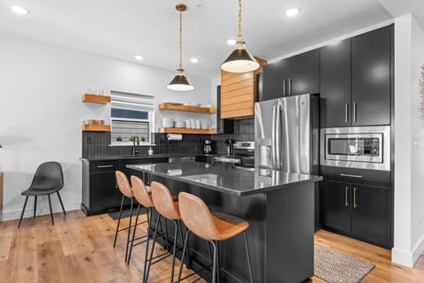 This kitchen was made for memory-making! Gather around meals in this fully stocked, open kitchen designed for gathering. This kitchen was made for memory-making!
