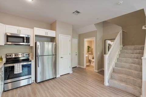 view from kitchen, half bathroom downstairs