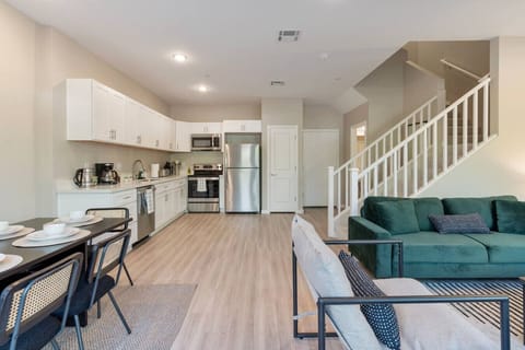 view from front entrance, dining table, living space, and full kitchen