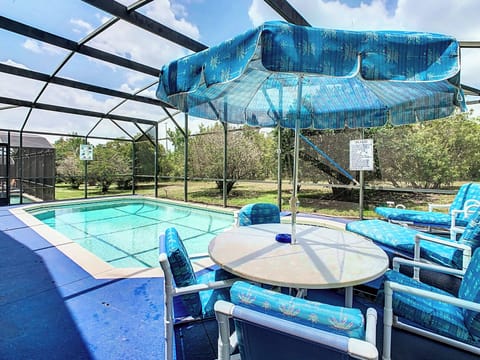 - Relax by the screened in pool surrounded by beautiful greenery and Florida sunshine
- Extra seating with loungers and a shaded patio table perfect for poolside meals
- Private and peaceful outdoor retreat, ideal for soaking up the warm breeze

