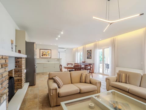 "Experience the epitome of elegance in our beautifully decorated living room, adorned with stunning art pieces."