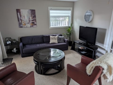 Living room with big screen TV includes Netflix and unlimited Internet.