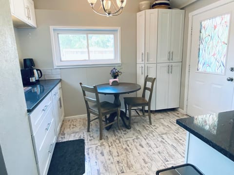 Kitchen table, 2 added chairs are in livingroom.