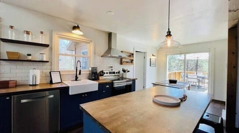 Kitchen Island with dining room by sliding glass door out to the back deck
