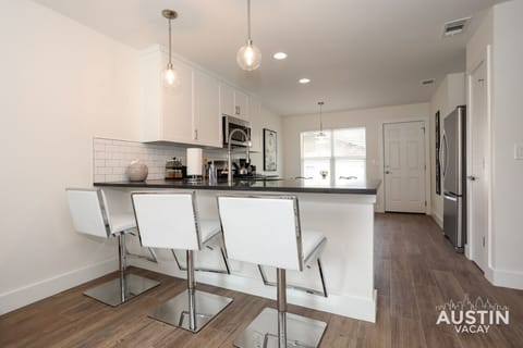 Bar seating at the fully equipped kitchen