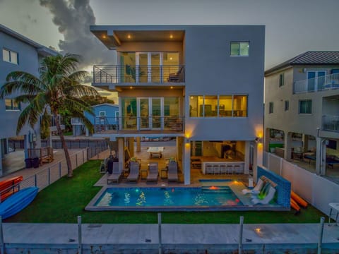 Sunset Aerial view of the home and pool