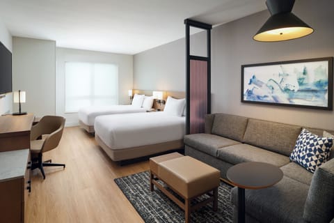 Unwind in a spacious suite with two plush beds.