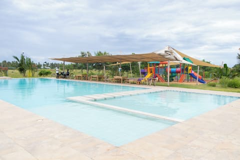 Outdoor pool and children's playground

