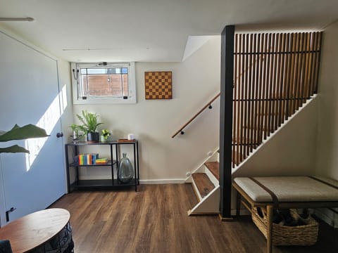 Entryway with bench, please remove your shoes before walking on the rug! 