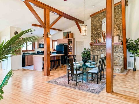 Vaulted ceilings, exposed beams and vintage tones in this enormous great room!