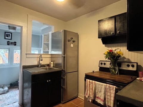 Functional kitchen equipped for cooking - microwave, coffee maker, toaster, too!