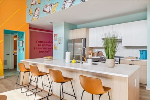 Fully stocked kitchen with stainless steel appliances, everything you`d need to make a home cooked meal, and 4 person eat in kitchen island