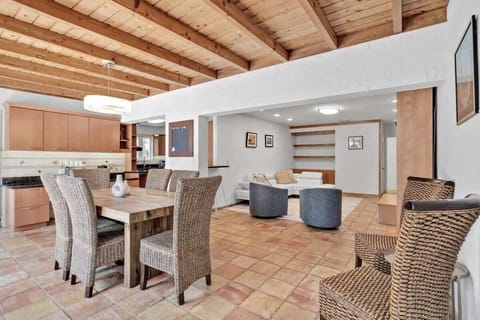 “Enjoy this spacious Airbnb rental with rustic beams, modern kitchen, and cozy living area—perfect vacation stay for family gatherings, relaxation, and unforgettable getaways.”