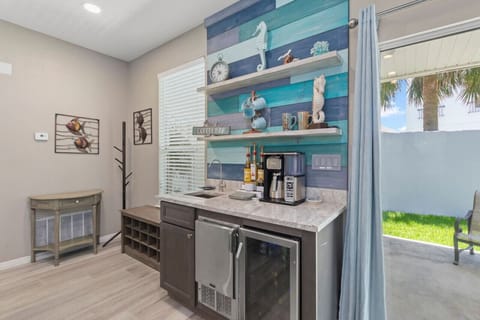 Seahorse Shores features a kitchenette with a lively and vibrant backsplash.