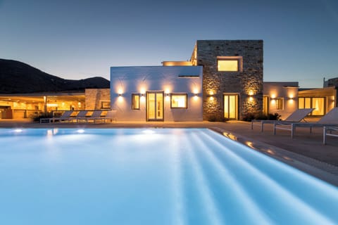 Gorgeous evening view of the building facade and pool